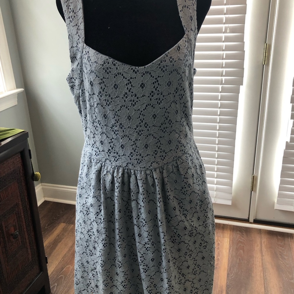 Lovely, lacy dress/jumper. Lined inside, with side zipper. Peek-a-boo back.